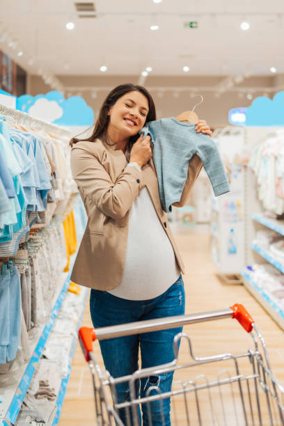 istock Beautiful young mother in baby shop 1651177319