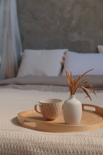 istock Cozy bedroom, Coffee or tea cup on the bed 1651184425