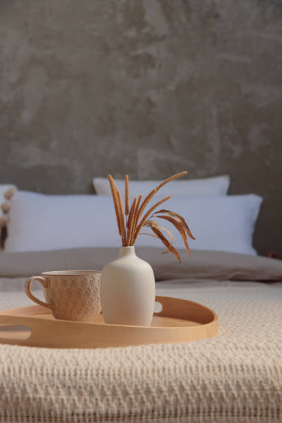 istock Cozy bedroom, Coffee or tea cup on the bed 1651184957