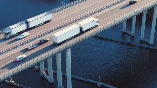 istock Trucks crossing a highway bridge 1651186582