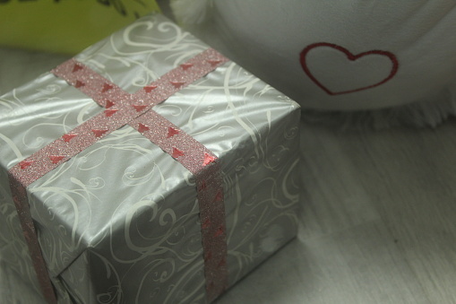 New Year Christmas gifts decorated with gift paper and bows. Festive atmosphere.