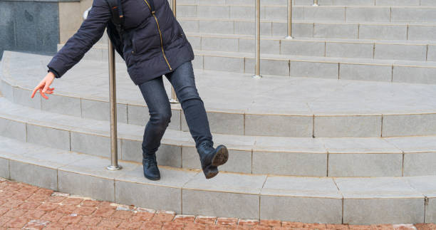 istock Falling Woman on Slippery Stairs, Icy Steps Fell, Unsafe Wet Steps, Slippery Stairs Problem 1651215905