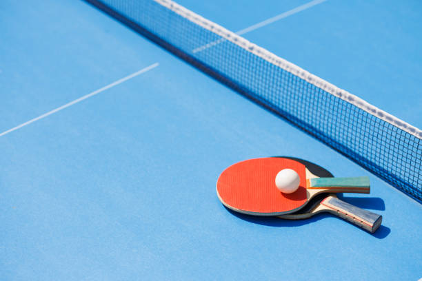istock tennis rackets for playing ping pong on blue table, ping pong concept 1651241360