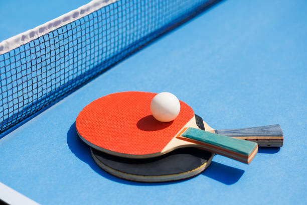 istock tennis rackets for playing ping pong on blue table, ping pong concept 1651241382