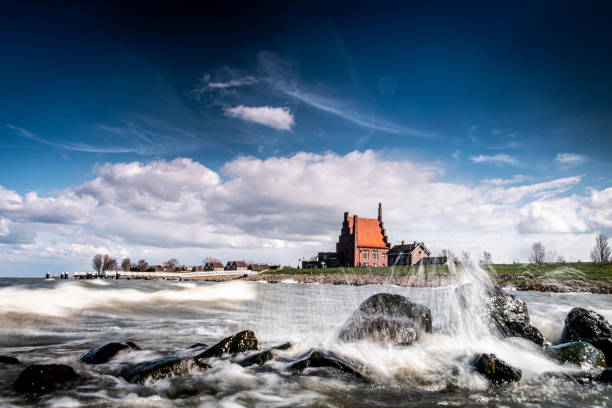 landscape view with water splash and cloudy sky landscape view with water splash and cloudy sky enkhuizen stock pictures, royalty-free photos & images