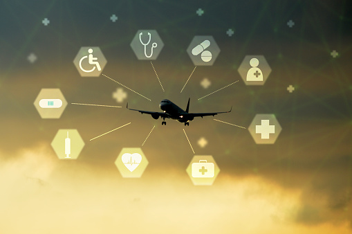 Medical tourism concept. Health tourism and international medical travel insurance. Airplane with medical icons on the sky background. Travel insurance