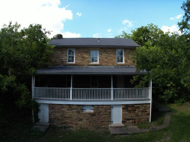 istock an old house sits in the woods overlooking a hill and trees 1651267651