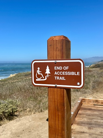 Accessible beach trail sign at Moonstone beach park Cambria, California