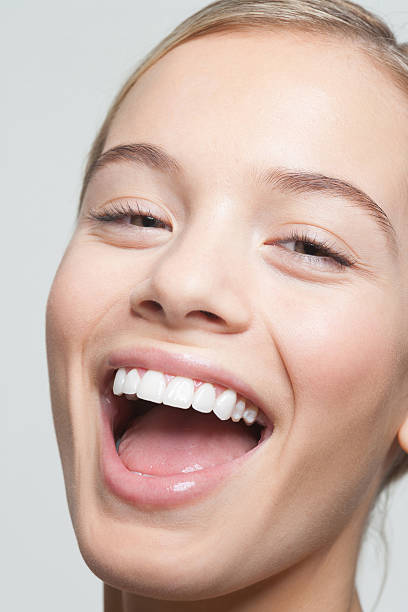 Close up portrait of woman laughing  mouth open stock pictures, royalty-free photos & images