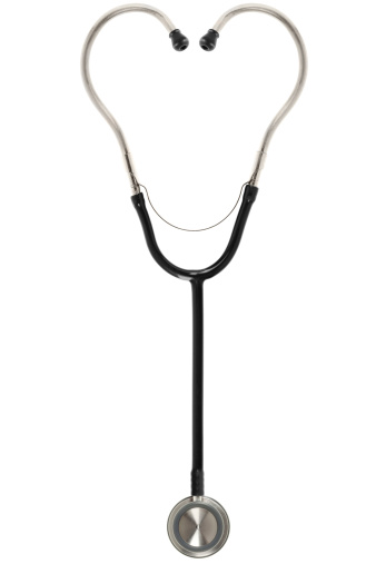 Hearth shaped stethoscope isolated on white.