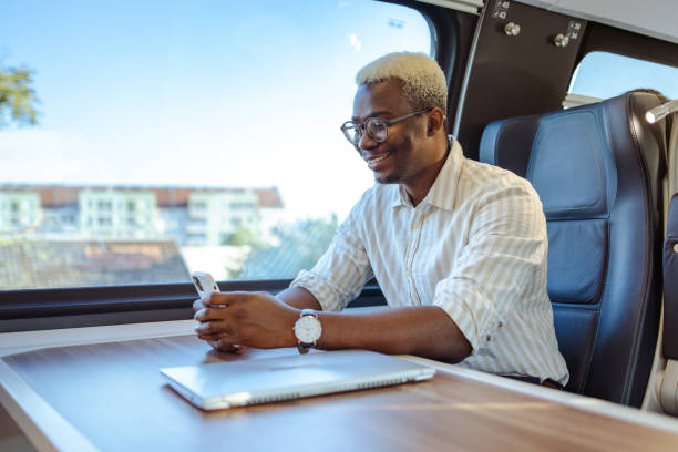 istock African American businessman using wireless technology in train 1651312229