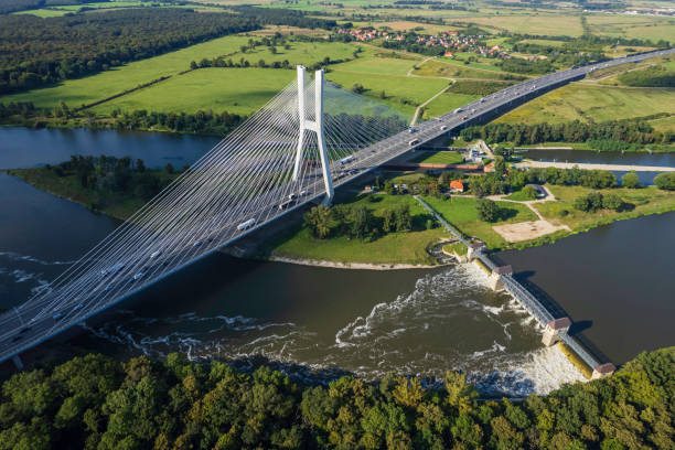 istock suspension bridge over the river (aerial) 1651312653