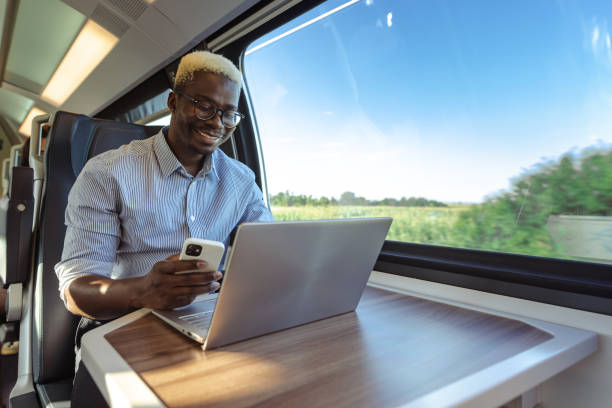 istock African American businessman using wireless technology in train 1651312696