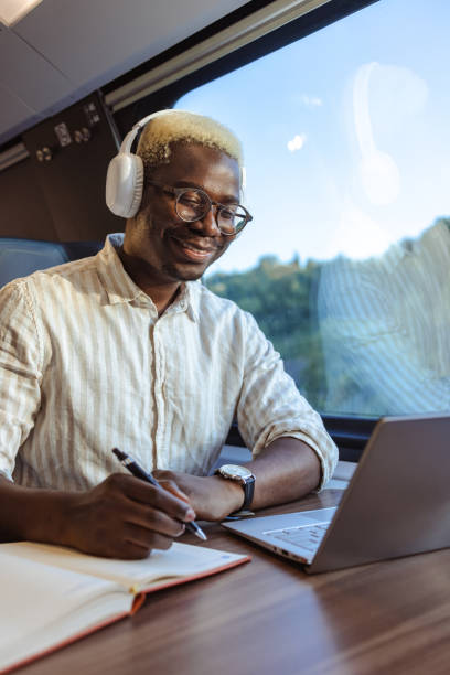 istock African American businessman writing notes in train 1651312873
