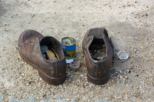 One Pair of men's iron shoes on concrete. Iron shoes