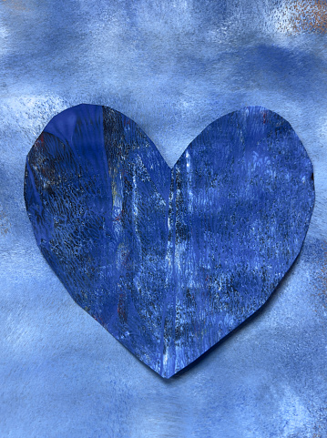 Blue heart on blue painted paper collage