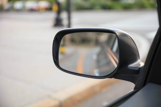 istock Car mirror reflects paths behind, a symbol of retrospection, foresight, and self-awareness, capturing life's rearview lessons 1651337835