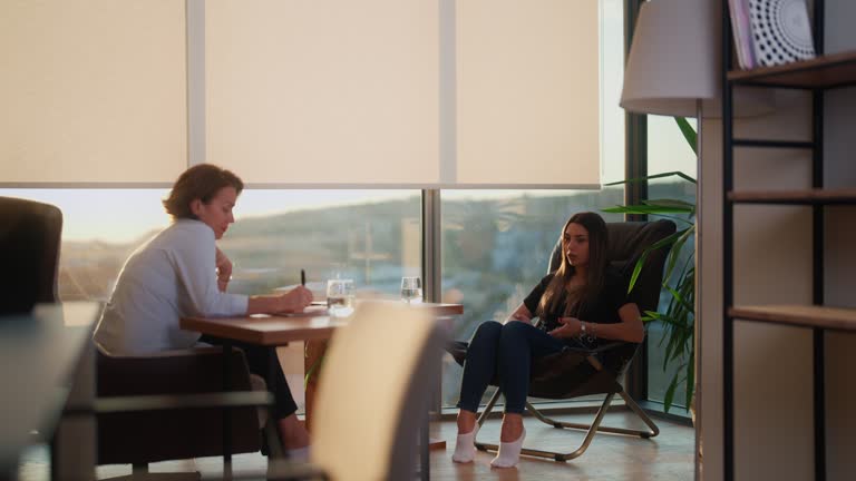 Female university student visiting mental health professional