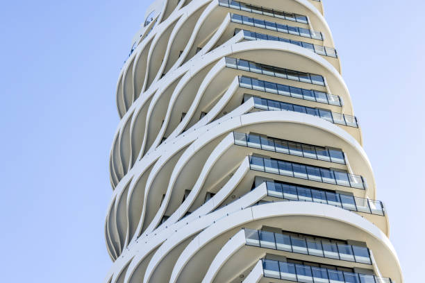 istock Closeup modern apartment building, blue sky background with copy space 1651344431