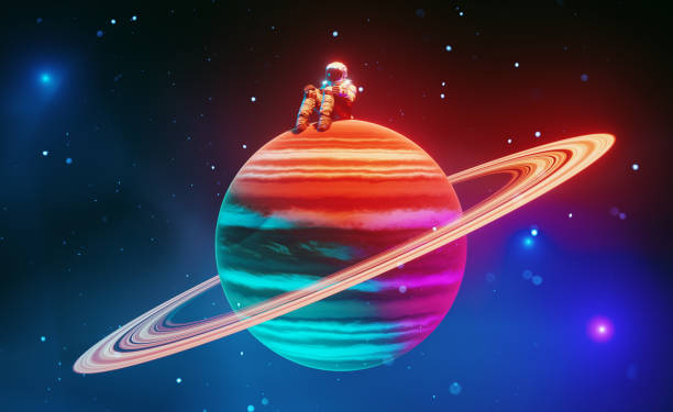 Lonely astronaut sits on colorful tiny planet in the middle of space stock photo