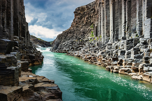 The dramatic Studlagil Canyon with basalt columns in Iceland