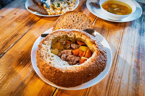 Traditional Icelandic Lamb Soup (Kjotsupa) in a bread bowl in Iceland.