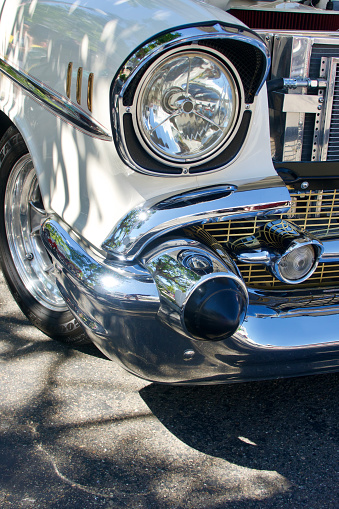 Closeup of front fender and bumper to a vintage car