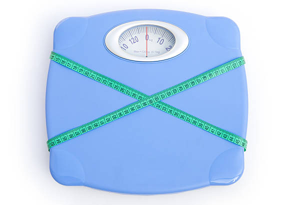 istock weight scale wrapped with a tape,clipping path included 165140755