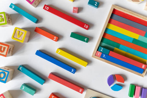 istock Colorful math feactions, numbers on white background.  Interesting fun, creative mathematics for kids. Education,  back to school concept. Mathematical backdrop 1651419578
