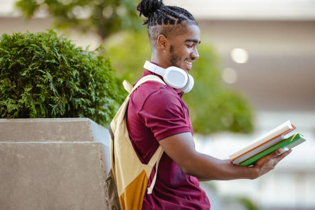 istock Cheerful male student on the street 1651456667