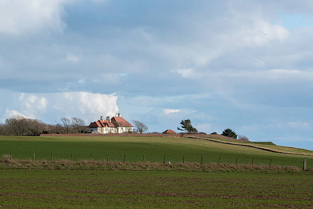 istock House across field 165150889