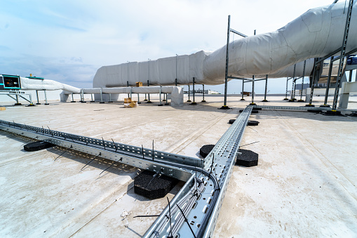 Cable tray for laying and protecting cables and wires on the roof of an industrial building
