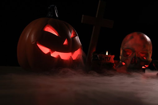 Candle-lit Halloween Pumpkins, Glowing Pumpkin , Scary Halloween pumpkin in dark background
