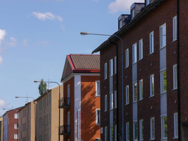 istock Low angle view of apartment buildings against sky 1651550212