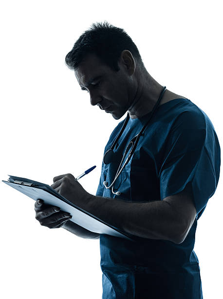 istock doctor man silhouette writing portrait 165155949