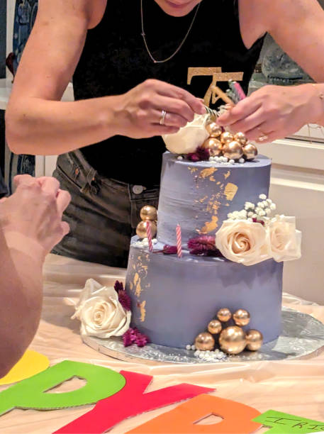istock Adding Candles to a Birthday Cake in Canada 1651586465