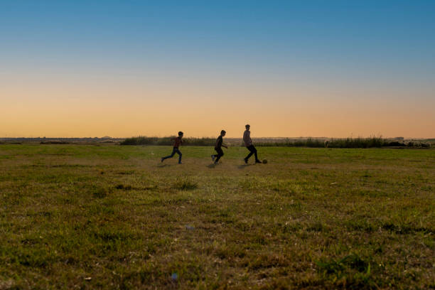 istock Children playing soccer in nature. 1651596878