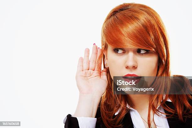 Business Woman With Hand To Ear Listening Isolated Stock Photo - Download Image Now - Beauty, Businesswoman, Young Adult