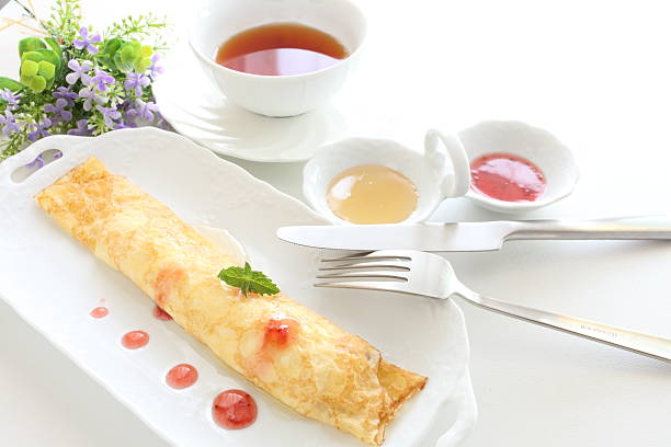 istock crepe with strawberry sauce and honey 165160968