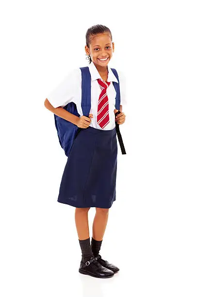 elementary schoolgirl full length isolated on white