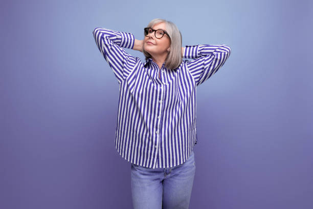 istock dreamy stylish mature old lady with gray hair on bright studio background with copy space 1651643732