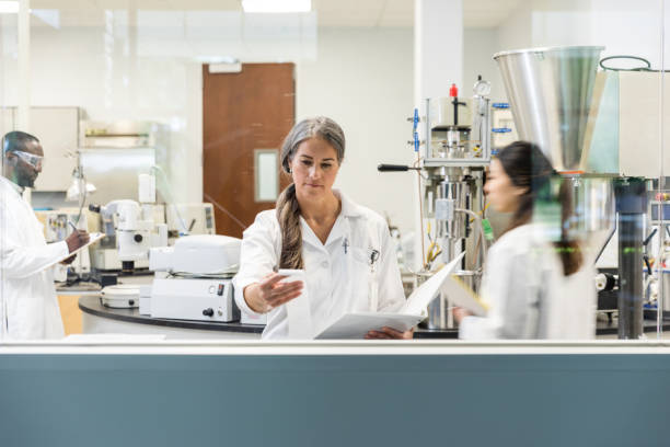 istock Coworkers move around the laboratory preparing for their work day 1651656625