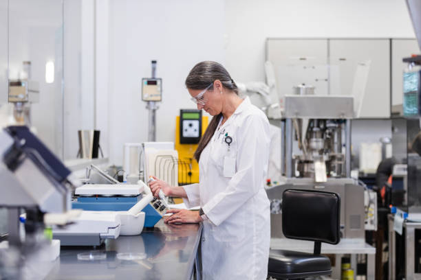 istock Mature female laboratory technician uses pipette to prepare a control sample 1651657190