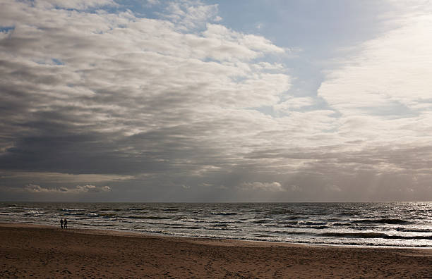 istock Couple walking on beach, Palanga, Lithuania 165165988