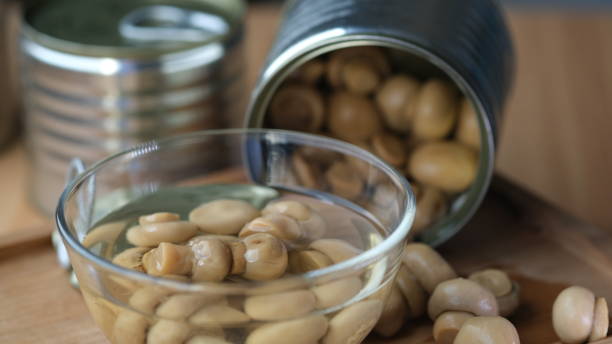 istock Canned champignon mushroom soaked in a small cup. 1651661489
