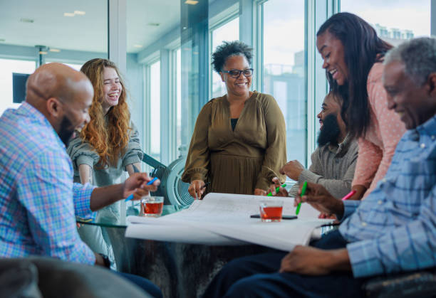 istock Friendly working team, laughing and drinking tea in the office. 1651667212