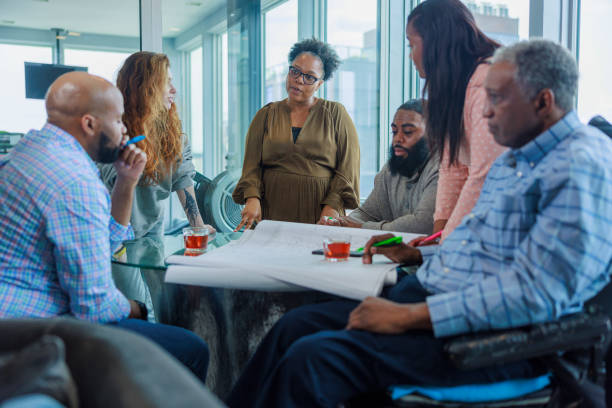 istock Multi-racial working partners brainstorming ideas for the project in the office. 1651667213
