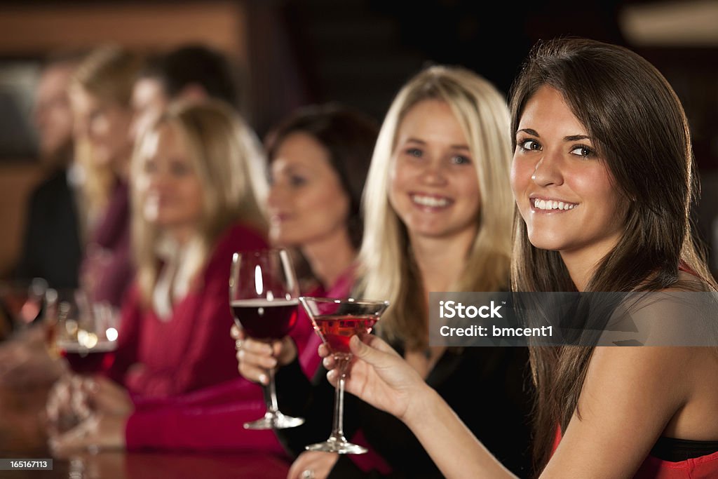 Smiling Young Female Friends Enjoying Drinks Group Of Smiling Young Female Friends Enjoying Drink 20-29 Years Stock Photo