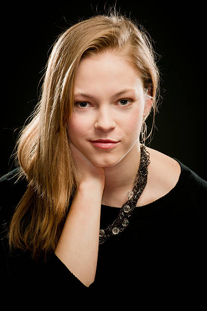 istock Confident Eye Contact From Blond Woman (Black Background) 165167118