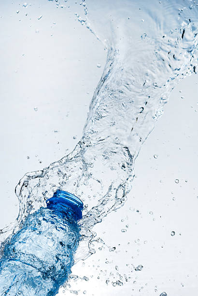 istock Water splash out of glass 165167671